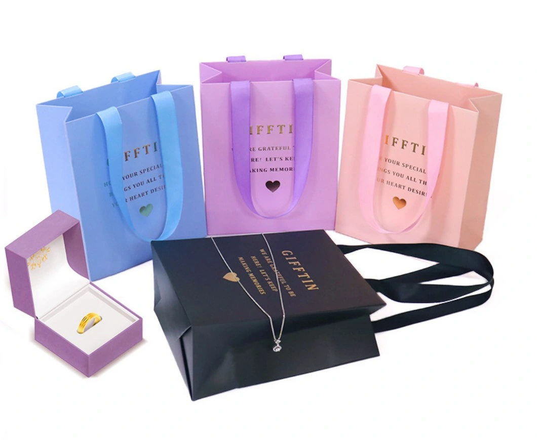 Low Price Garment Jewelry Cosmetic Gift Shopping Paper Bags with Handles Hand-Held Kraft Cardboard Paper Tote Packing Bag for Takeaway Food Packaging Business
